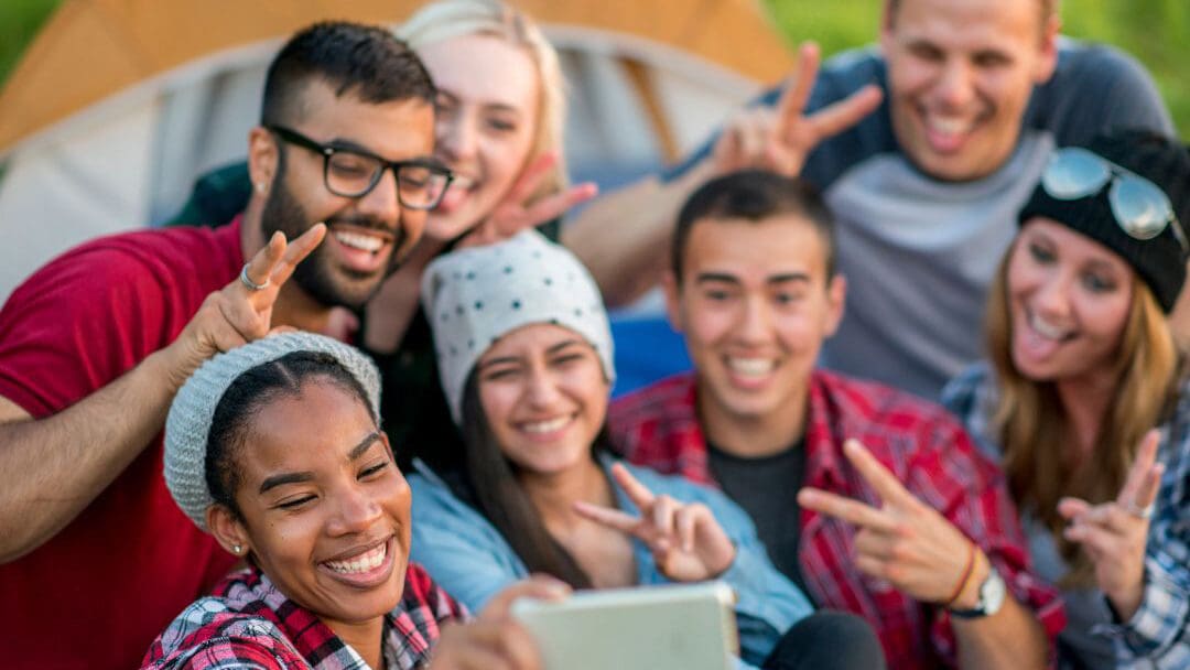 A group of people taking a selfie photo